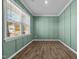 A versatile home office space with wainscoting and wood-look floors at 110 Lodgepole Ln, Burlington, NC 27215