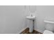 Powder room featuring a pedestal sink and modern fixtures at 110 Lodgepole Ln, Burlington, NC 27215