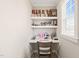 Bright home office area with built-in shelving, desk, and natural light from the nearby window at 1301 Mackinaw Dr, Wake Forest, NC 27587