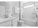 Bright bathroom featuring a shower-tub combo and a sleek vanity with countertop at 138 Clear Water Rd, Louisburg, NC 27549