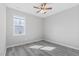 Bedroom with a ceiling fan, large window and wood flooring at 138 Clear Water Rd, Louisburg, NC 27549