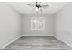 Inviting bedroom with a ceiling fan, window and neutral walls and wood flooring at 138 Clear Water Rd, Louisburg, NC 27549