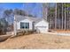 Charming one story home featuring an inviting curb appeal with a side view of the attached two-car garage at 138 Clear Water Rd, Louisburg, NC 27549