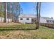 Exterior view of home with a backyard, fencing and treed surroundings at 138 Clear Water Rd, Louisburg, NC 27549
