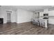 Spacious open living room with kitchen island seating and modern flooring at 138 Clear Water Rd, Louisburg, NC 27549