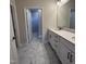 Bathroom with double vanity, modern fixtures, and marble floors at 138 Oban Dr, Homesite 134, Sanford, NC 27330