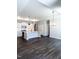 Modern kitchen with white cabinets, stainless steel appliances, and a center island for food preparation at 138 Oban Dr, Homesite 134, Sanford, NC 27330