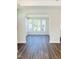 Bright living area featuring hardwood floors and large windows with ample natural light at 138 Oban Dr, Homesite 134, Sanford, NC 27330
