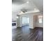 Inviting living room features a fireplace, hardwood floors, and access to a bright sunroom at 138 Oban Dr, Homesite 134, Sanford, NC 27330