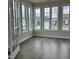 Charming sunroom with hardwood floors and large windows providing great neighborhood views at 138 Oban Dr, Homesite 134, Sanford, NC 27330