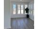 Bright sunroom featuring hardwood floors and an abundance of natural light through large windows at 138 Oban Dr, Homesite 134, Sanford, NC 27330