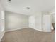 Spacious bedroom with carpeted floors, ample natural light, and a walk-in closet at 140 Southern Acres Dr, Fuquay Varina, NC 27526