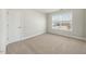 Comfortable bedroom with carpeted floors, large window for natural light and a double door closet at 140 Southern Acres Dr, Fuquay Varina, NC 27526