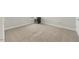 The bedroom has a neutral color and features carpeted floors and a baseboard trim to the walls at 140 Southern Acres Dr, Fuquay Varina, NC 27526