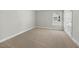 Bright bedroom with carpet flooring, a large window, and a view of the outdoors at 140 Southern Acres Dr, Fuquay Varina, NC 27526