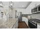Contemporary kitchen with a large island, stainless steel refrigerator, and stylish countertops at 140 Southern Acres Dr, Fuquay Varina, NC 27526