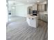 Modern kitchen with a large center island, sleek appliances, and stylish countertops in an open-concept layout at 142 Oban Dr, Homesite 135, Sanford, NC 27330