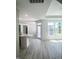 Bright living room featuring hardwood floors, white walls, and modern lighting, perfect for entertaining at 142 Oban Dr, Homesite 135, Sanford, NC 27330