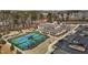 Aerial view of community clubhouse, tennis courts, and parking at 1435 Monterey Bay Dr, Wake Forest, NC 27587