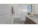 Well-lit bathroom featuring a shower-tub combo and a vanity with a granite countertop at 1435 Monterey Bay Dr, Wake Forest, NC 27587