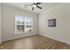 Cozy bedroom with hardwood floors, a ceiling fan, and a bright window with blinds at 1435 Monterey Bay Dr, Wake Forest, NC 27587
