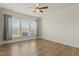 Cozy bedroom with ceiling fan and large windows, and hardwood flooring at 1435 Monterey Bay Dr, Wake Forest, NC 27587