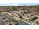 Aerial view of a community clubhouse, tennis courts and ample parking spaces at 1435 Monterey Bay Dr, Wake Forest, NC 27587