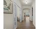 Inviting hallway features hardwood floors, stylish doors, and an arched opening to the living area at 1435 Monterey Bay Dr, Wake Forest, NC 27587