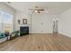 Bright living area with fireplace, large windows, and ceiling fan at 1435 Monterey Bay Dr, Wake Forest, NC 27587