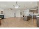 Spacious open-concept living area with fireplace, kitchen island, and modern lighting at 1435 Monterey Bay Dr, Wake Forest, NC 27587