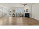 A sunlit living room features a fireplace, large windows, and a door leading to an outdoor area at 1435 Monterey Bay Dr, Wake Forest, NC 27587