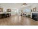 Bright living room with hardwood floors, fireplace, and modern kitchen with island and bar stool seating at 1435 Monterey Bay Dr, Wake Forest, NC 27587