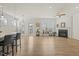 A sunlit living room features a fireplace, large windows, and a door leading to an outdoor area at 1435 Monterey Bay Dr, Wake Forest, NC 27587
