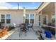 Outdoor patio with wrought iron dining set and a partial view of the screened in porch at 1435 Monterey Bay Dr, Wake Forest, NC 27587