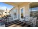 Relaxing screened porch with striped rug, comfortable seating and outdoor access at 1435 Monterey Bay Dr, Wake Forest, NC 27587