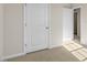 Bedroom with neutral carpet and two doors at 173 Paper Birch Way, Fuquay Varina, NC 27526