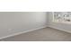 Bedroom with neutral carpet and window with view of the yard at 173 Paper Birch Way, Fuquay Varina, NC 27526