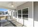 Covered back porch featuring a ceiling fan, views of the neighborhood, and plenty of natural light at 192 Springhill Ln, Garner, NC 27529