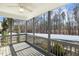 Covered back porch overlooking wooded backyard, providing a serene and relaxing outdoor space at 192 Springhill Ln, Garner, NC 27529