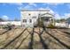 The backyard features a well-maintained lawn, privacy fence, and a charming covered porch at 192 Springhill Ln, Garner, NC 27529