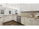 Bright kitchen features granite countertops, stainless steel appliances, and white cabinets at 192 Springhill Ln, Garner, NC 27529