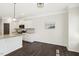 Kitchen with kitchen island featuring granite countertops and seating for dining at 192 Springhill Ln, Garner, NC 27529