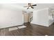 Bright, open living room with hardwood floors, white trim, and abundant natural light streaming through the windows at 192 Springhill Ln, Garner, NC 27529