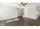 Empty living room space featuring hardwood floors and crown molding detail at 192 Springhill Ln, Garner, NC 27529
