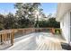 Spacious back deck features wood flooring with a clear view to the surrounding wooded area at 217 Northfield Dr, Raleigh, NC 27609