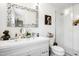 A well-lit bathroom featuring a double vanity, a large mirror, and a glass-enclosed shower, offers a spa-like experience at 217 Northfield Dr, Raleigh, NC 27609