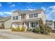 Attractive two-story home with a stone facade, a two-car garage, and a well-manicured lawn at 2437 Cedar Rock Dr, Wake Forest, NC 27587