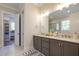 This spacious bathroom boasts a double sink vanity, white countertop, and an accessible walk-in closet at 25 Blackhorn Ct, Pittsboro, NC 27312