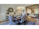 Inviting dining room with stylish decor, modern lighting, and hardwood floors at 25 Blackhorn Ct, Pittsboro, NC 27312