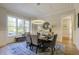 Dining area featuring natural light, modern chandelier, and stylish decor at 25 Blackhorn Ct, Pittsboro, NC 27312